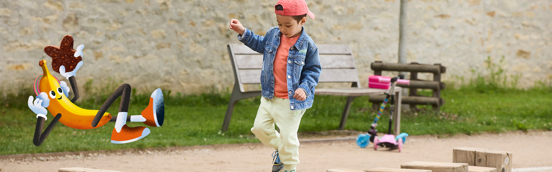 Kid playing on a field with a fun banana