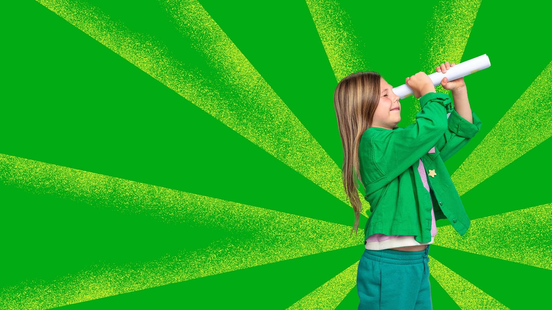 Girl peeking through paper telescope