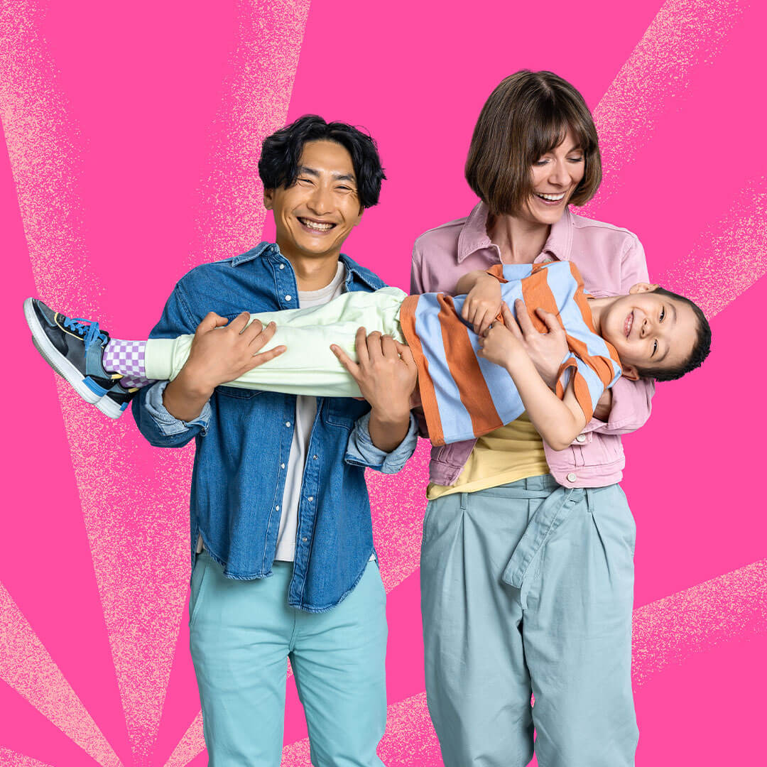 Happy parents holding their kid