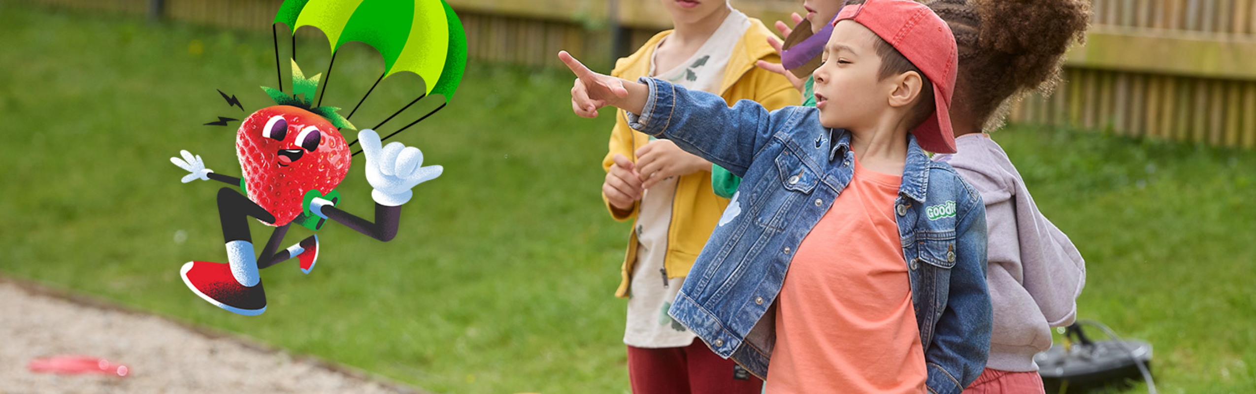 Kids pointing to Sparky the Strawberry