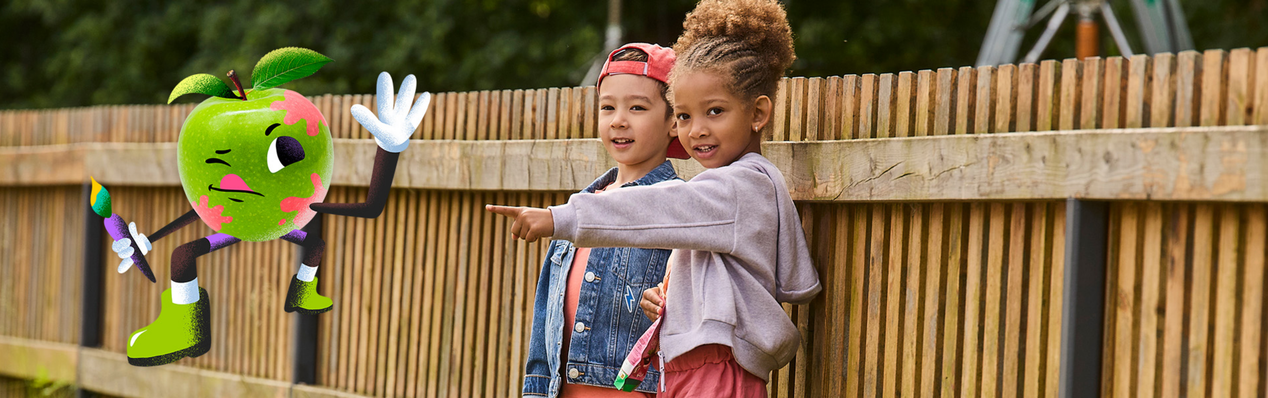 Kids pointing to apple character